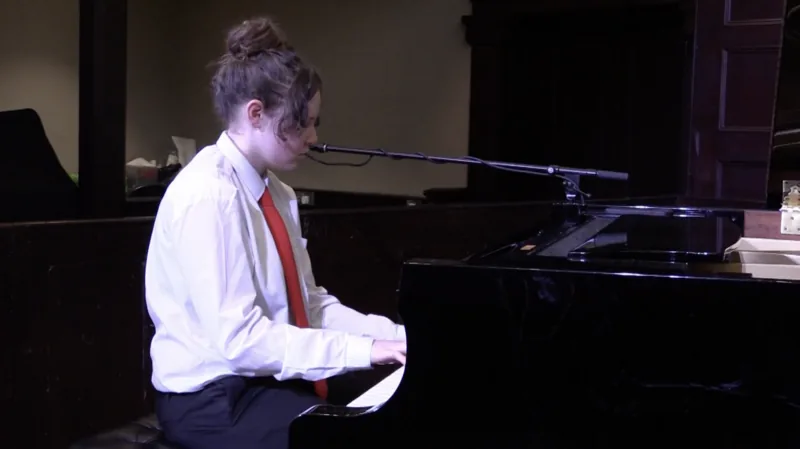 Grand piano in dramatic lighting